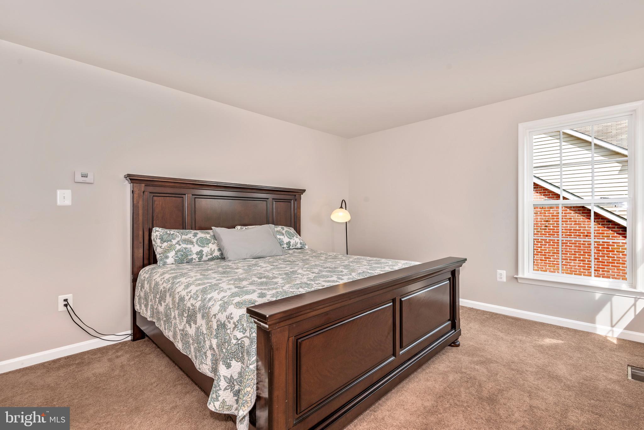 1713 Canal Run Drive Point of Rocks, MD 21777 - Photo 32 of 38 a bedroom with a bed and a window