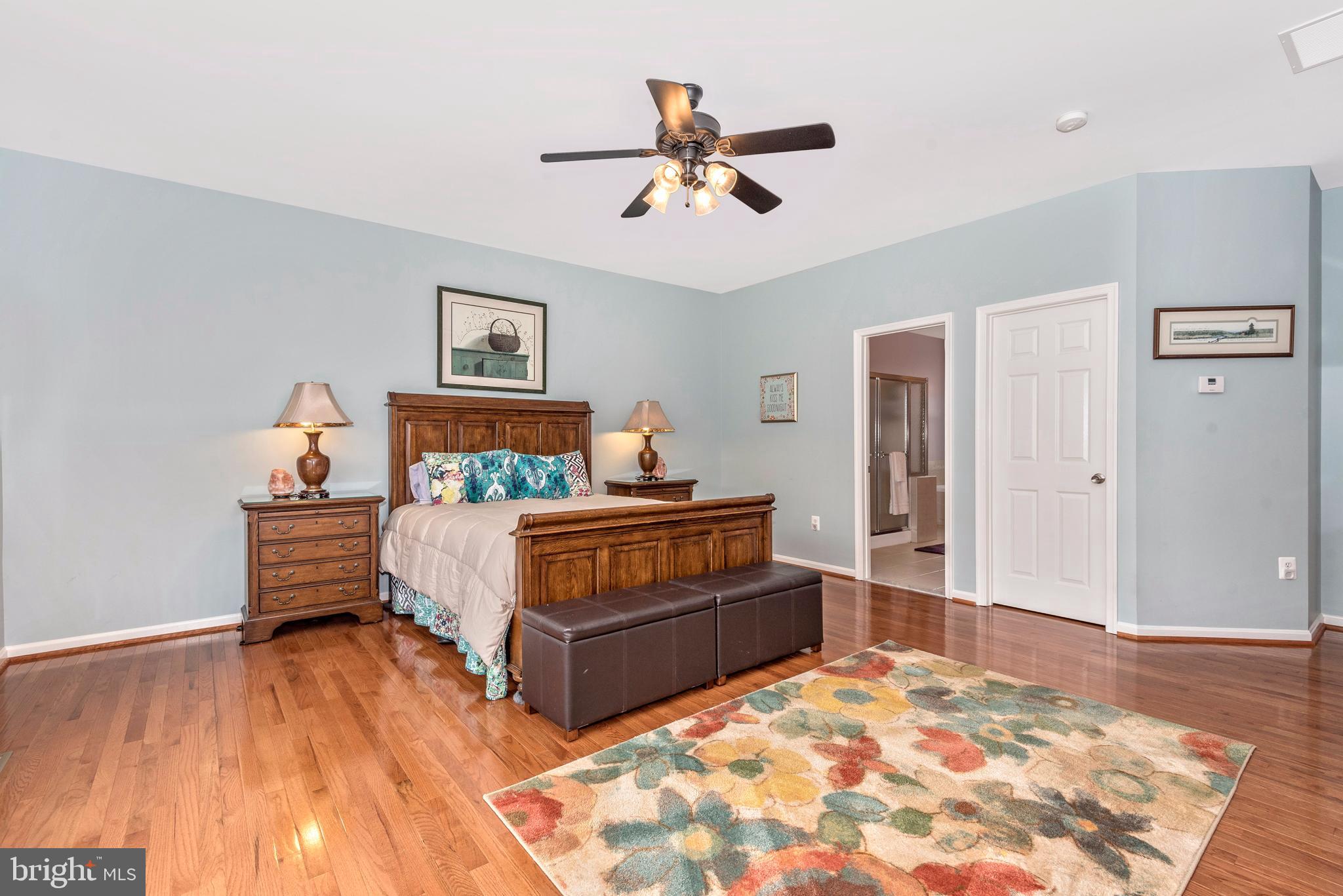1713 Canal Run Drive Point of Rocks, MD 21777 - Photo 10 of 38 a bedroom with a bed and dresser with wooden floor