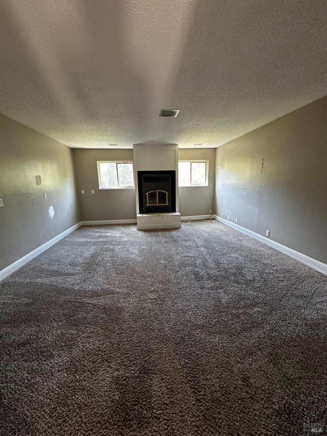 2015 Tennessee Street Vallejo, CA 94590 - Photo 16 of 29 a view of an empty room with a fireplace and a window
