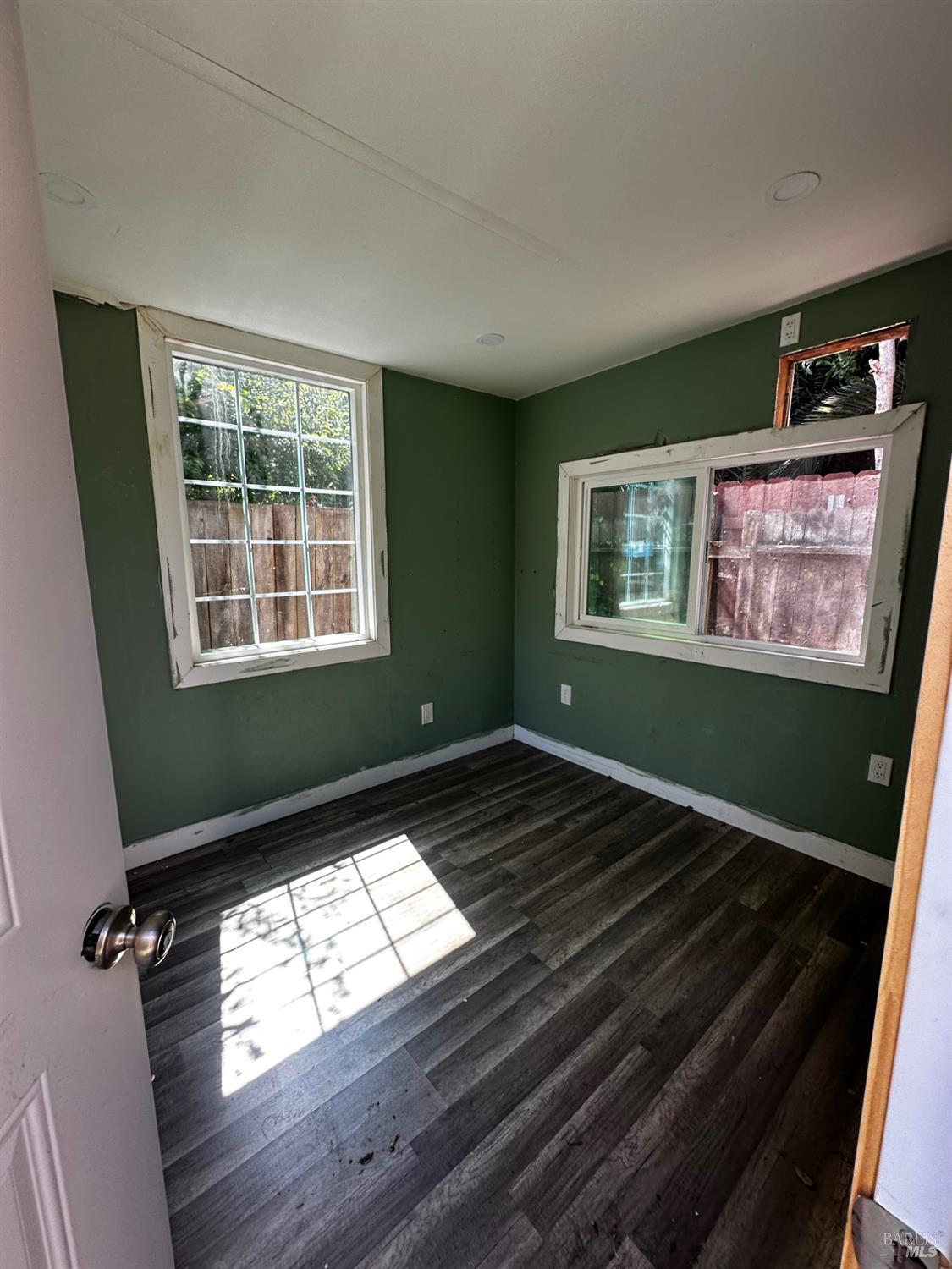 2015 Tennessee Street Vallejo, CA 94590 - Photo 25 of 29 a view of an empty room with wooden floor and a window
