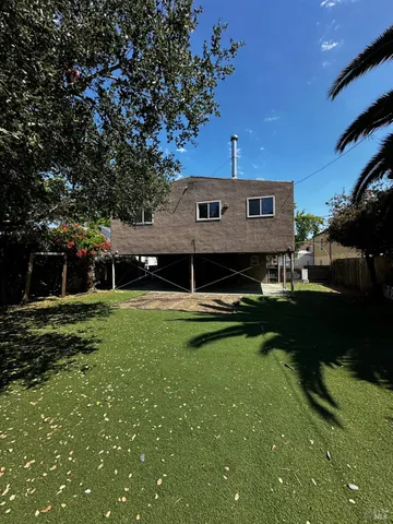 a view of a house with a back yard