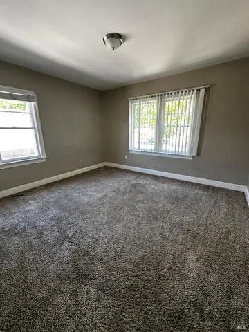 a view of an empty room with a window