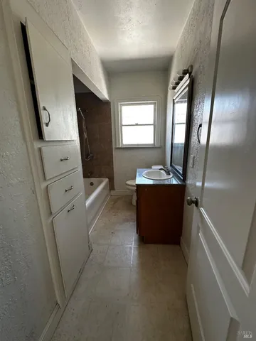 a view of a hallway with washer and dryer