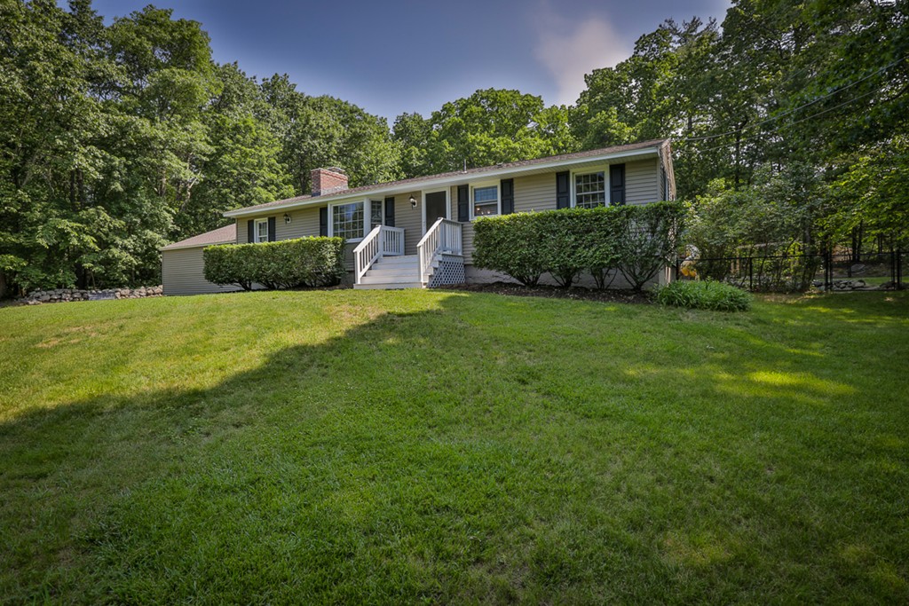 101 Chestnut Road Tyngsborough, MA 01879 - Photo 1 of 26 a view of a house with backyard and garden