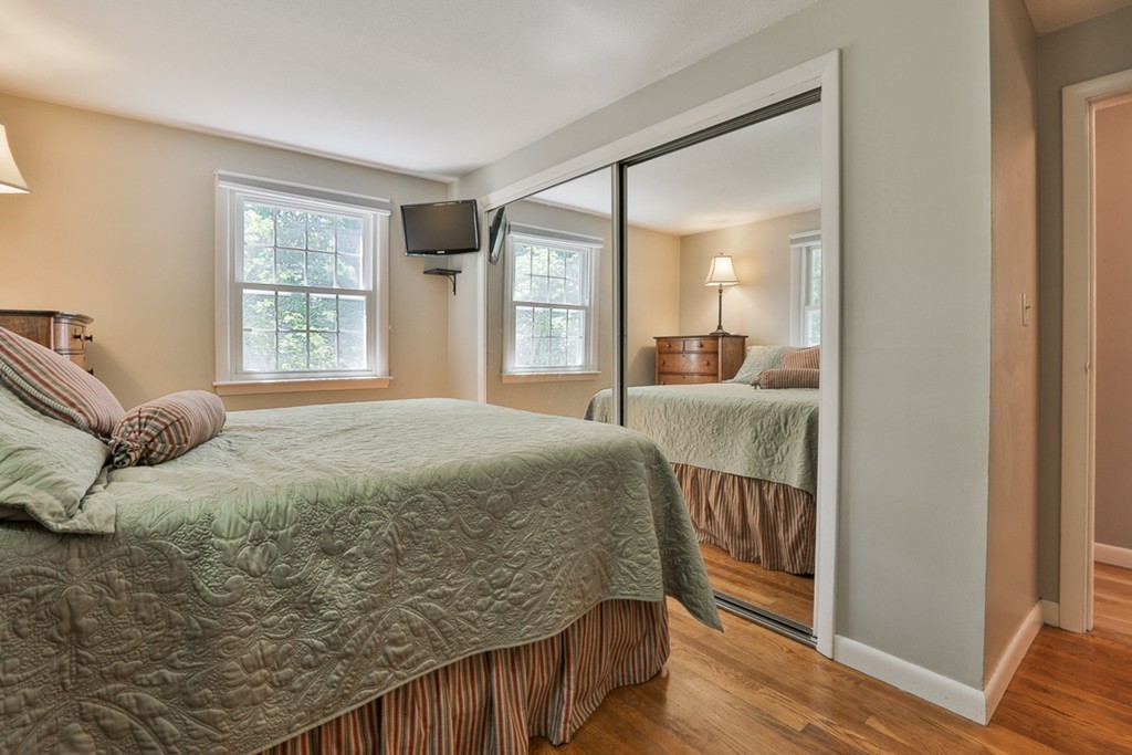 101 Chestnut Road Tyngsborough, MA 01879 - Photo 14 of 26 a bedroom with a bed and a large window with outer view