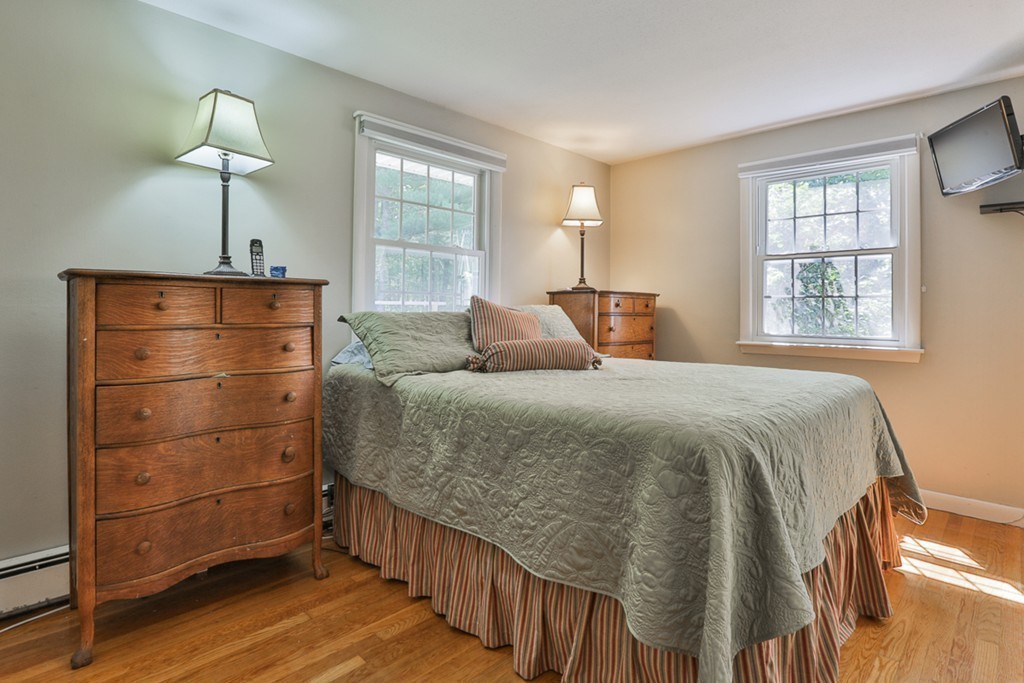 101 Chestnut Road Tyngsborough, MA 01879 - Photo 15 of 26 a bedroom with a bed and a window