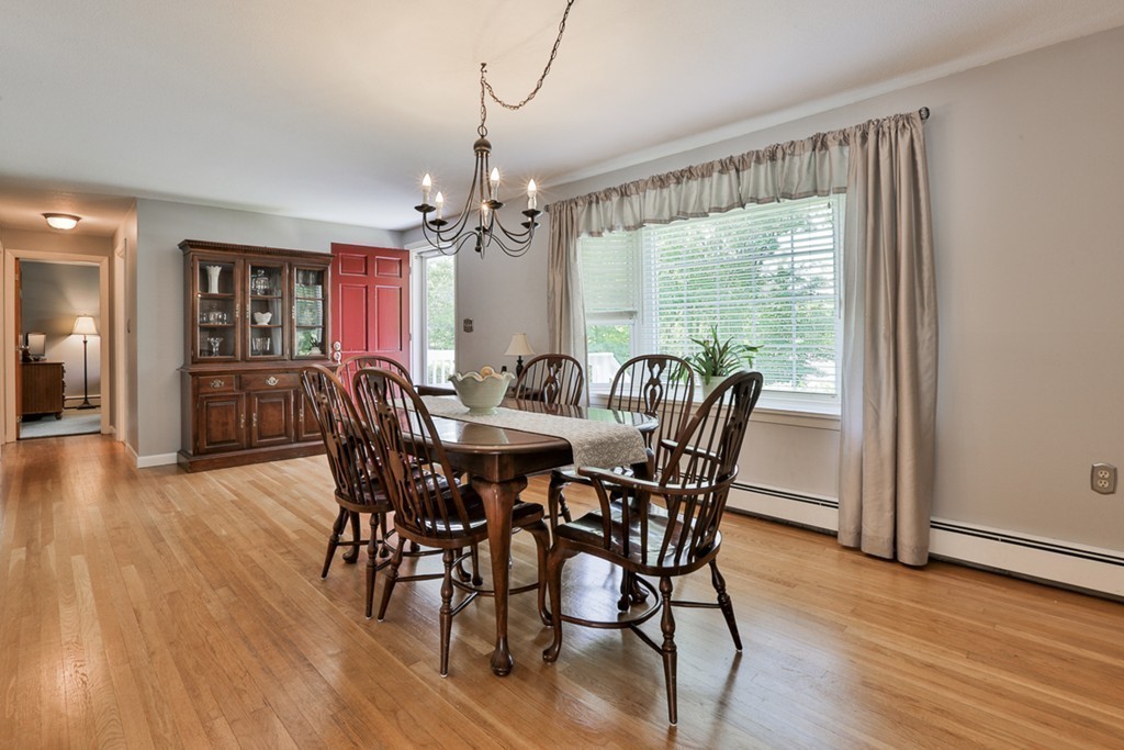 101 Chestnut Road Tyngsborough, MA 01879 - Photo 2 of 26 a view of a dining room with furniture window and wooden floor