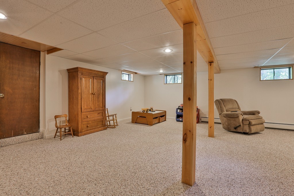 101 Chestnut Road Tyngsborough, MA 01879 - Photo 21 of 26 a view of living room filled with furniture and a couch