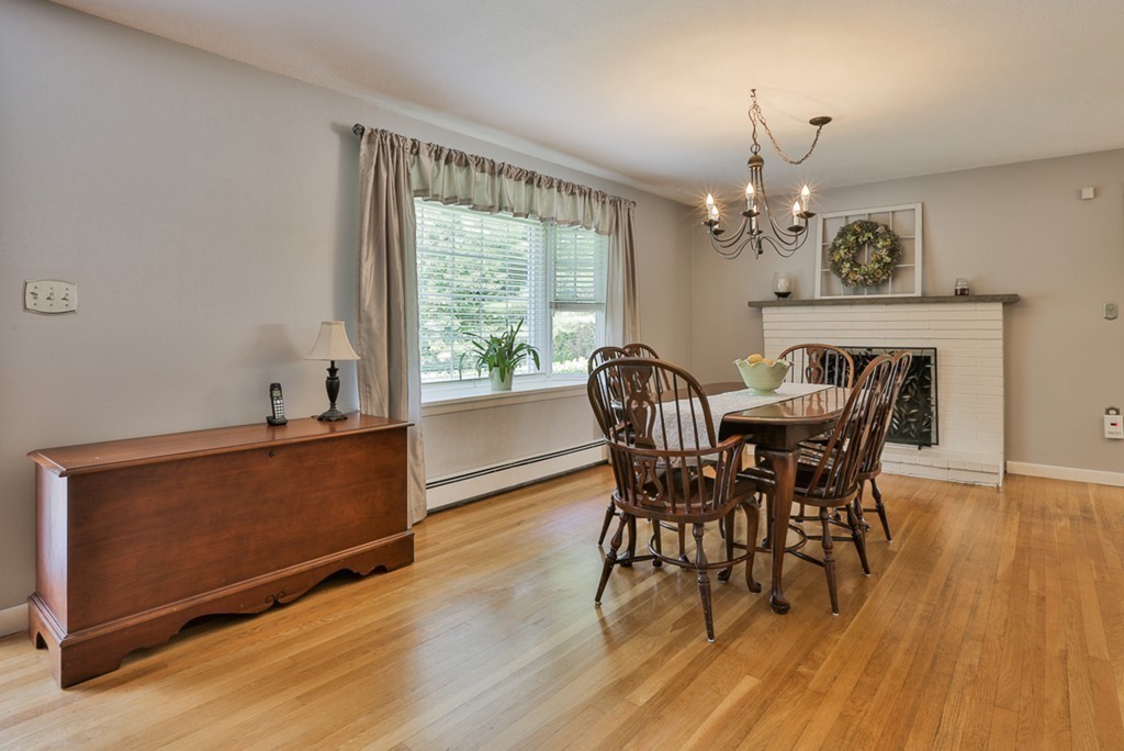 101 Chestnut Road Tyngsborough, MA 01879 - Photo 3 of 26 a view of a dining room with furniture a chandelier and wooden floor