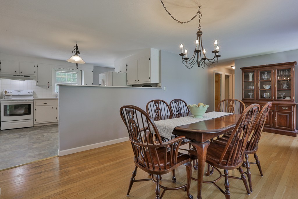 101 Chestnut Road Tyngsborough, MA 01879 - Photo 4 of 26 a view of a dining room with furniture and chandelier