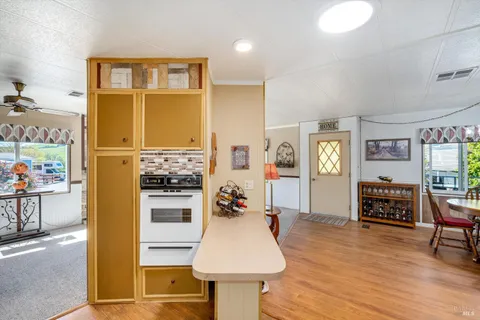 a living room with fireplace furniture and a window