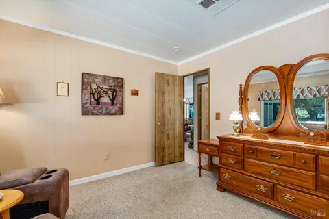 a room with furniture and mirror