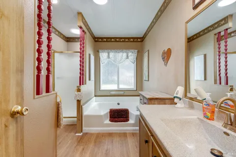a bathroom with a sink a vanity and a mirror