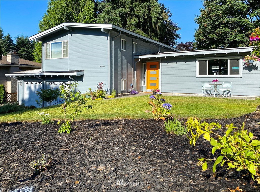 21904 1st Place West Bothell, WA 98021 - Photo 1 of 35 a front view of a house with garden