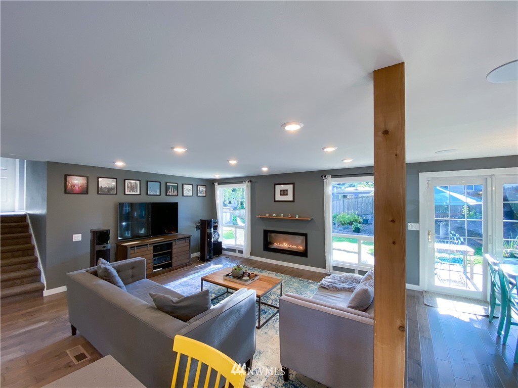 21904 1st Place West Bothell, WA 98021 - Photo 11 of 35 a living room with furniture and a flat screen tv