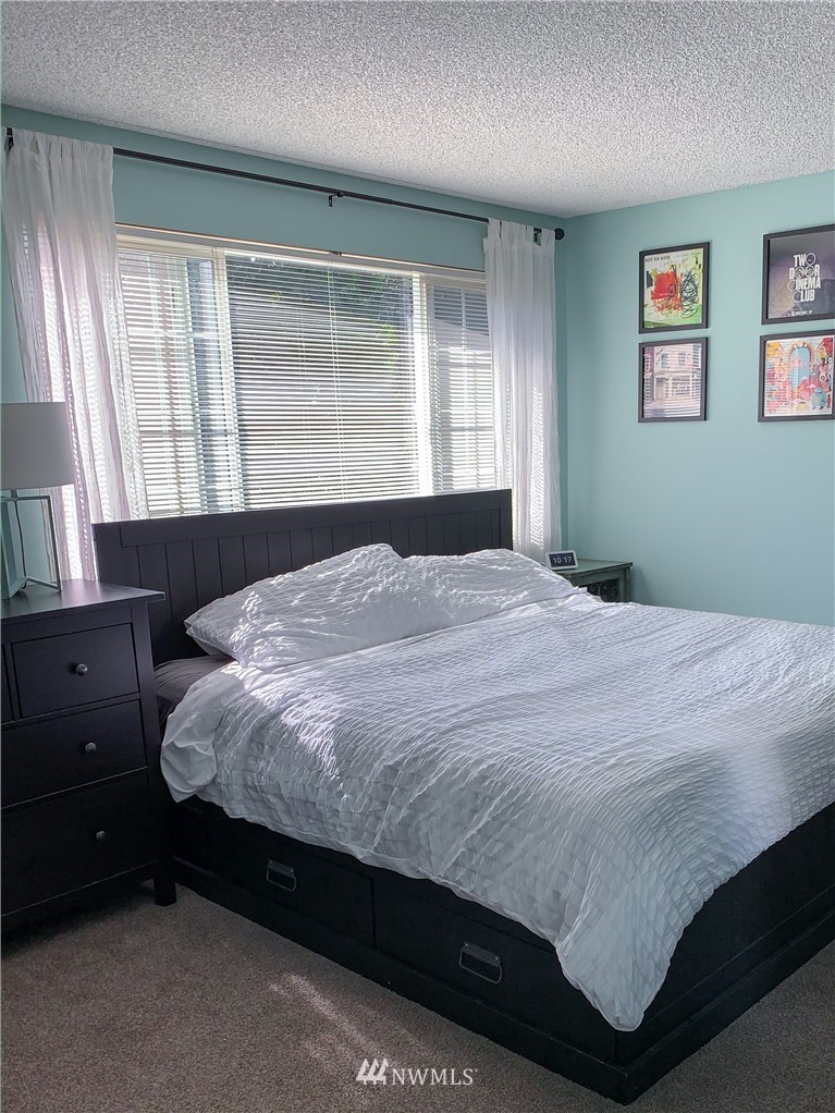 21904 1st Place West Bothell, WA 98021 - Photo 21 of 35 a bedroom with a bed and window