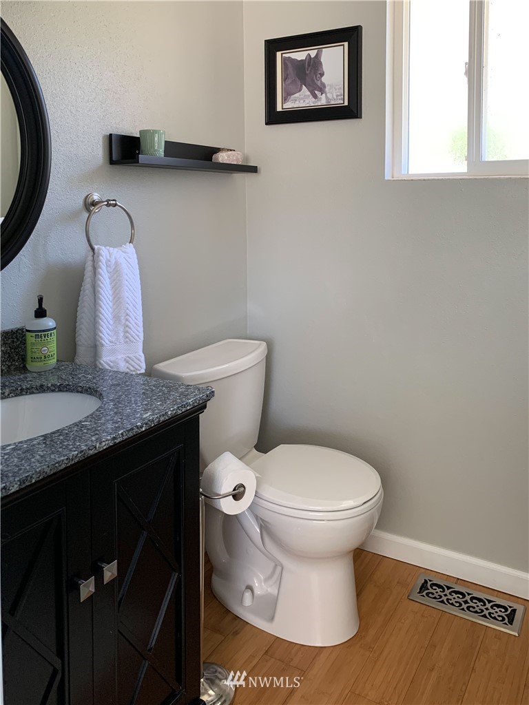 21904 1st Place West Bothell, WA 98021 - Photo 23 of 35 a bathroom with a granite countertop toilet and a sink