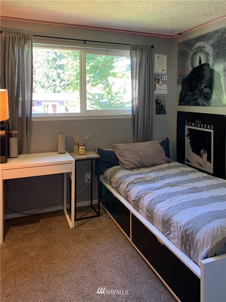 21904 1st Place West Bothell, WA 98021 - Photo 24 of 35 a bedroom with a bed and a window