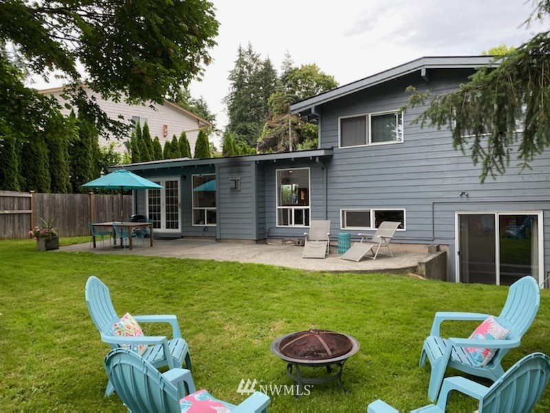 21904 1st Place West Bothell, WA 98021 - Photo 34 of 35 a view of a house with backyard tub and chairs