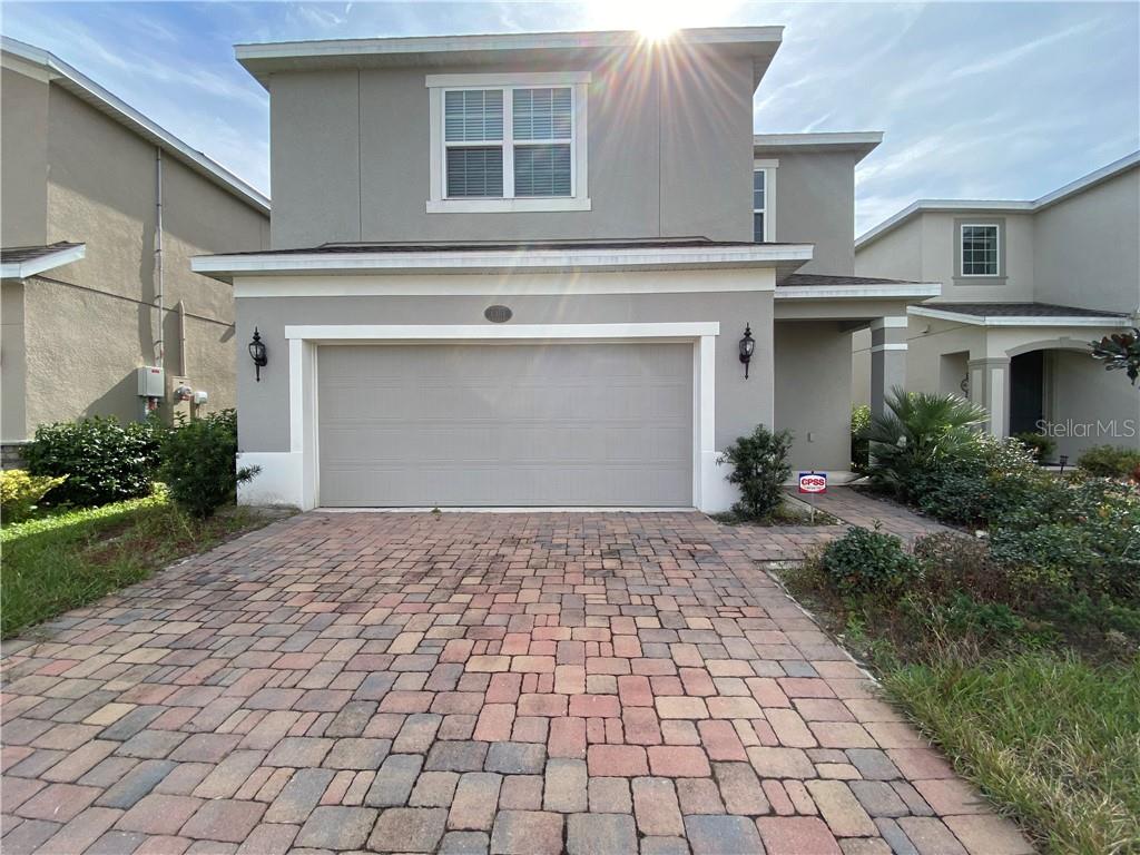 1351 Riley Circle DeLand, FL 32724 - Photo 1 of 1 a front view of a house with a yard and garage