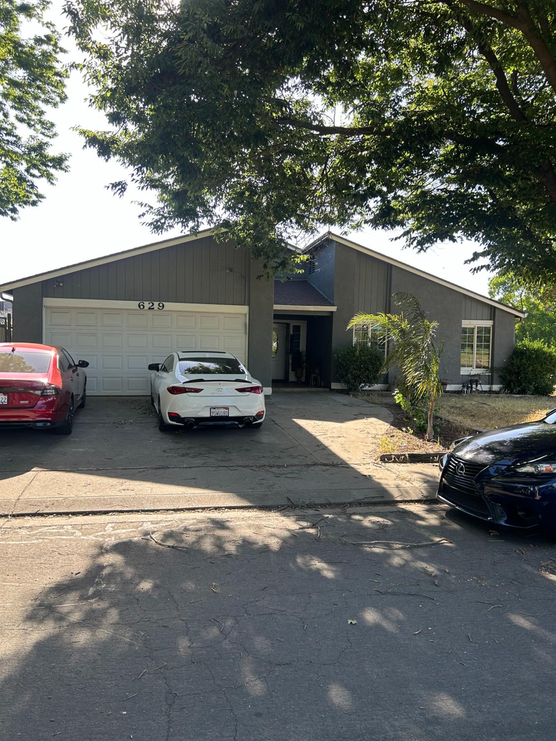 a car parked in front of a house