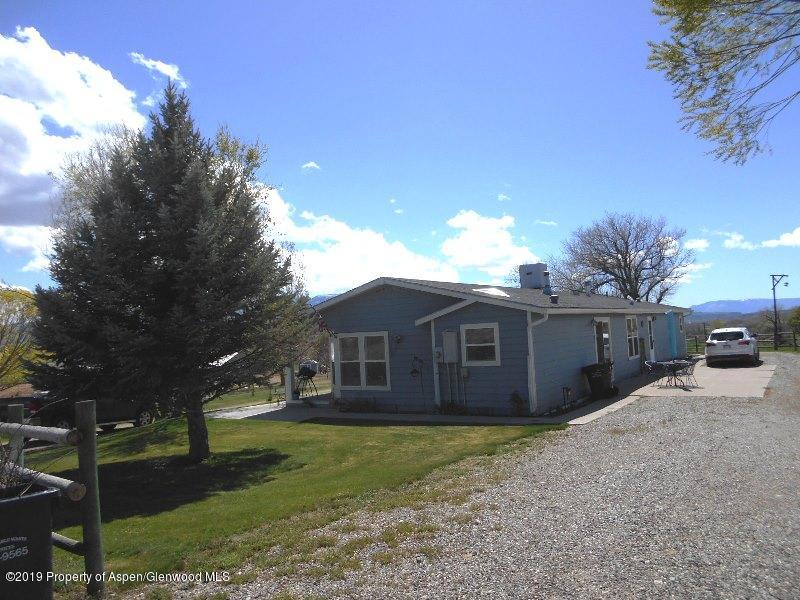 520 Lariat Road Silt, CO 81652 - Photo 2 of 30 a view of a house with a yard and large tree