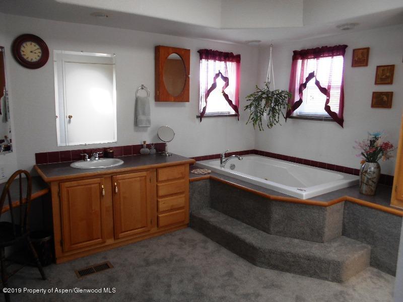 520 Lariat Road Silt, CO 81652 - Photo 29 of 30 a bathroom with a sink and a mirror