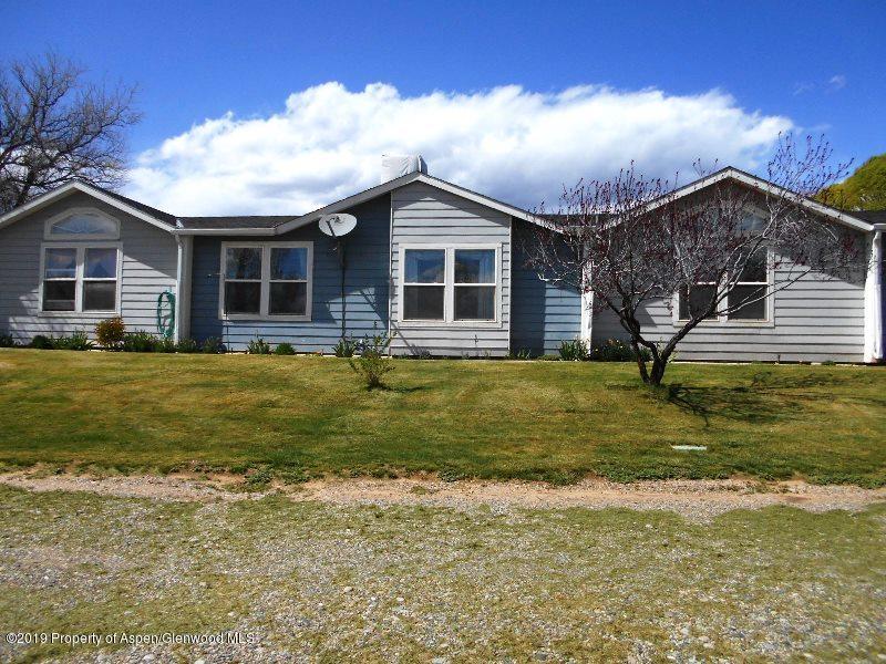 520 Lariat Road Silt, CO 81652 - Photo 3 of 30 a front view of a house with a yard