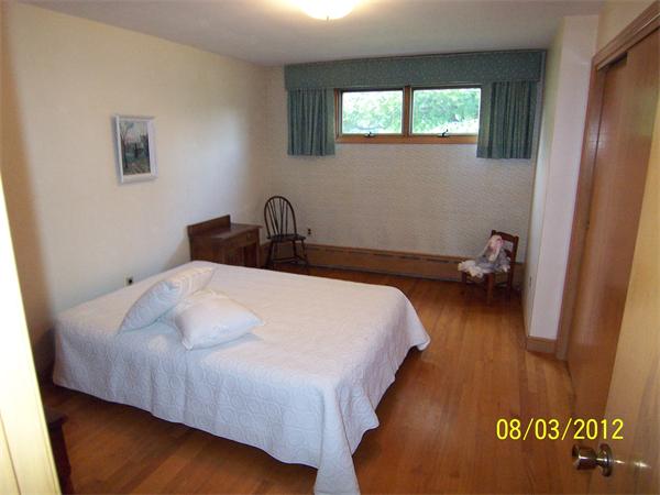44 Mayflower Road Winchester, MA 01890 - Photo 11 of 29 a bedroom with a bed and a window