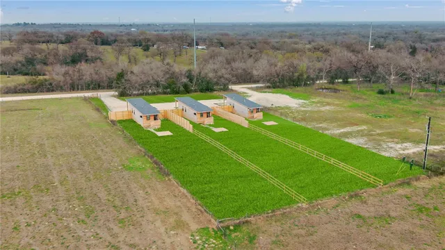 a view of a lake with a yard