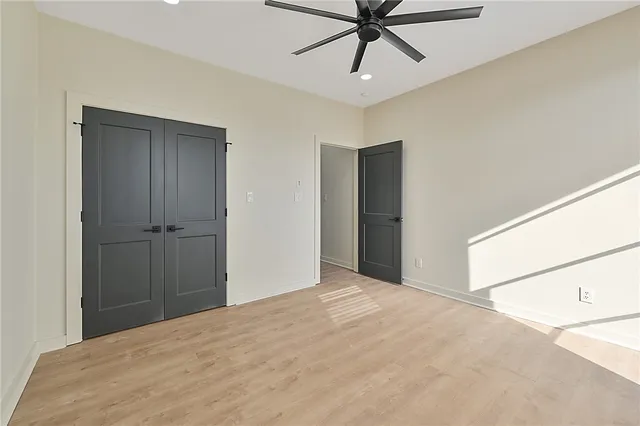 a view of a room with a ceiling fan