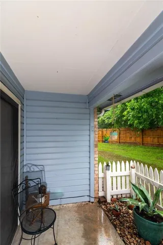 a room with furniture and a potted plant
