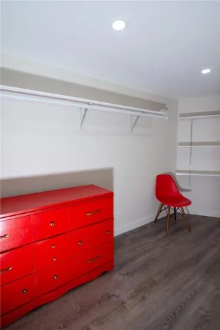 a room with a desk and pool chair