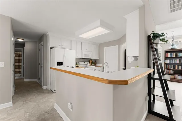 a bedroom with a bed and a ceiling fan