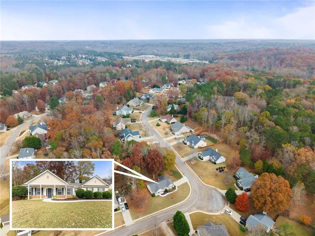 an aerial view of residential houses with outdoor space