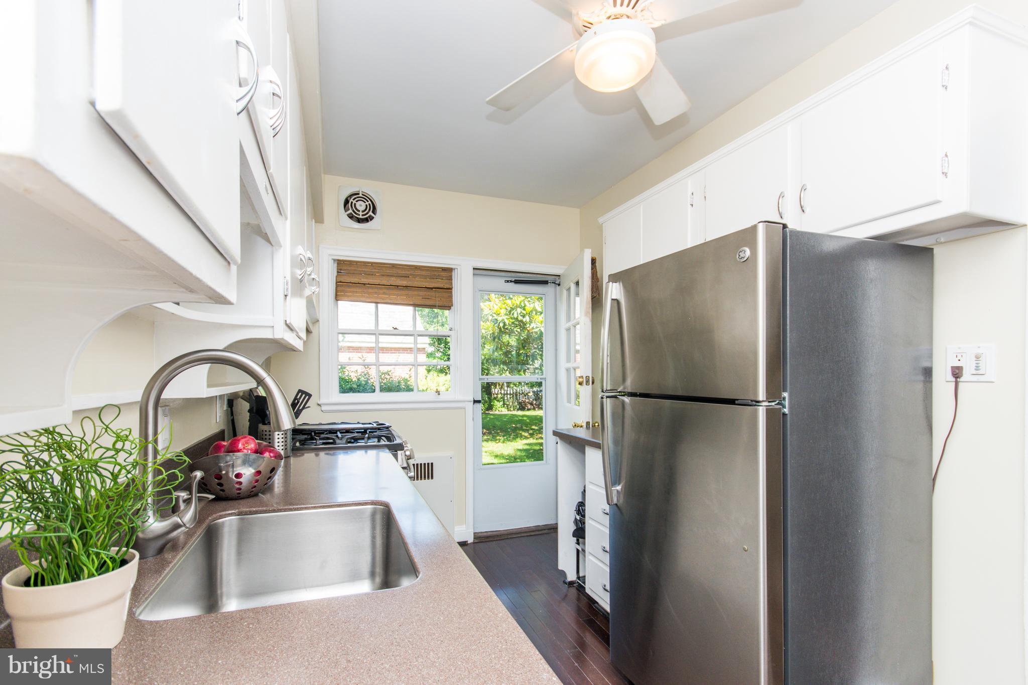 5001 Broadmoor Road Baltimore, MD 21212 - Photo 11 of 26 a kitchen with stainless steel appliances granite countertop a refrigerator and a sink
