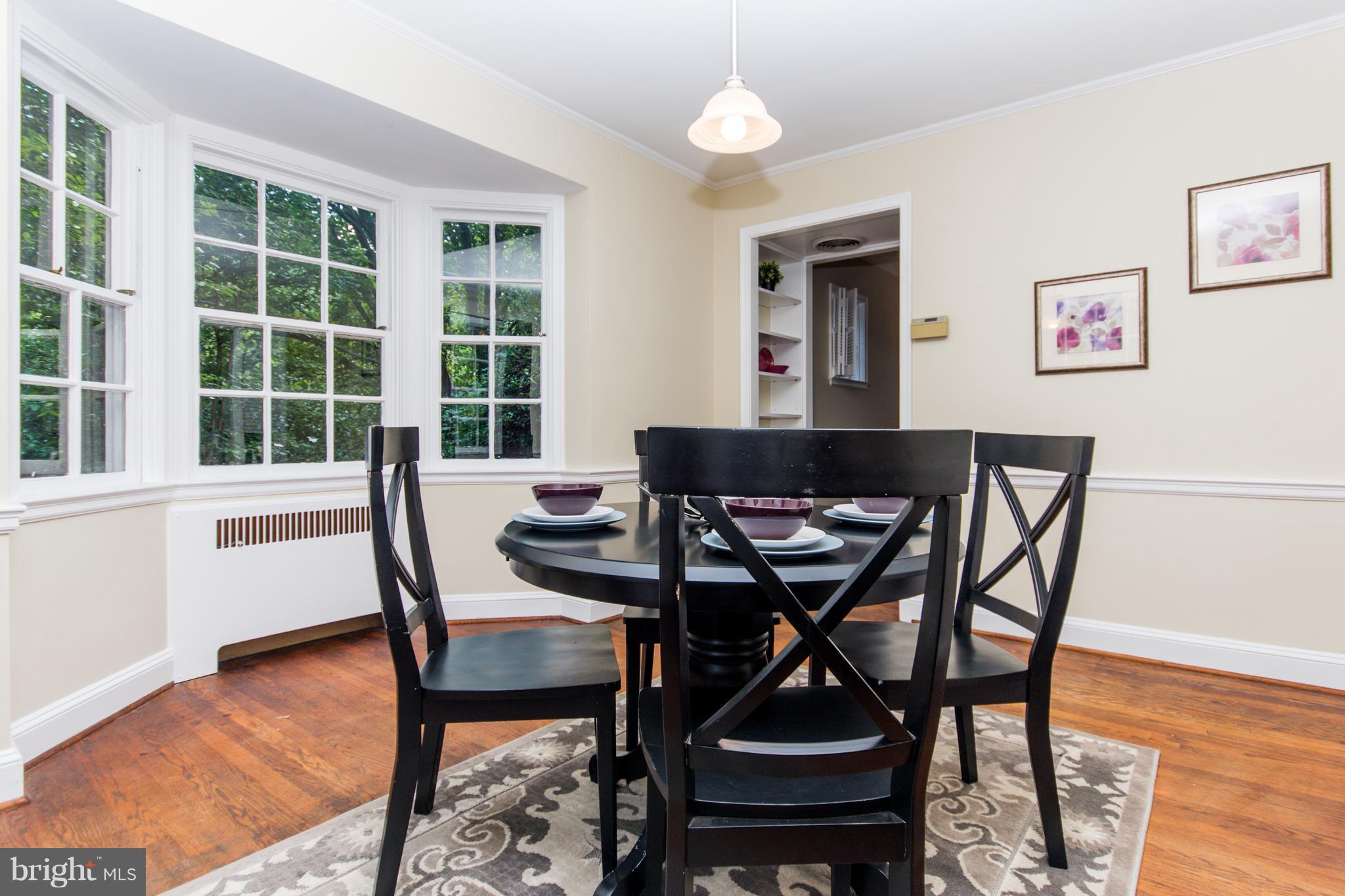 5001 Broadmoor Road Baltimore, MD 21212 - Photo 12 of 26 a view of a dining room with furniture and wooden floor