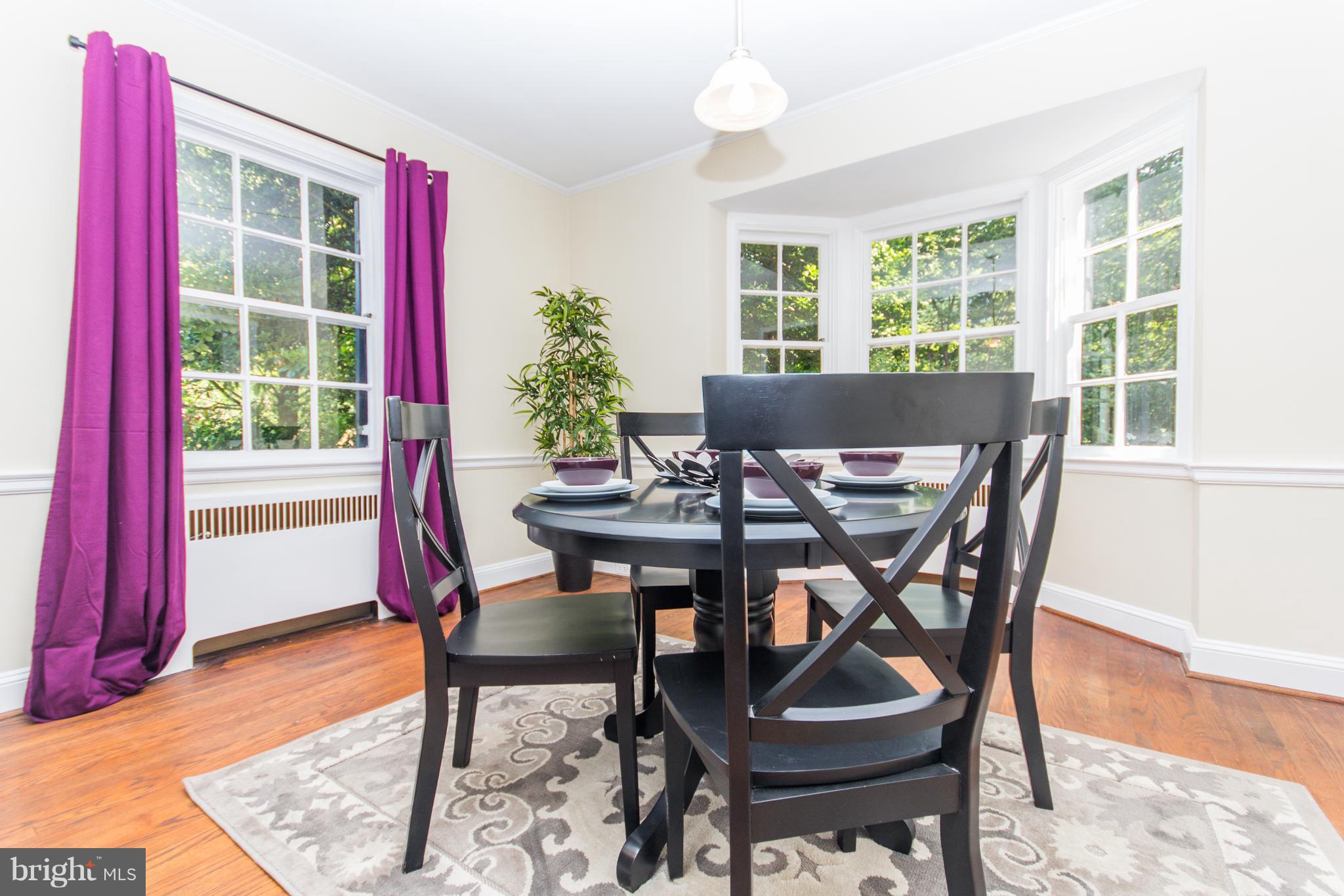 5001 Broadmoor Road Baltimore, MD 21212 - Photo 13 of 26 a view of a dining room with furniture window and wooden floor