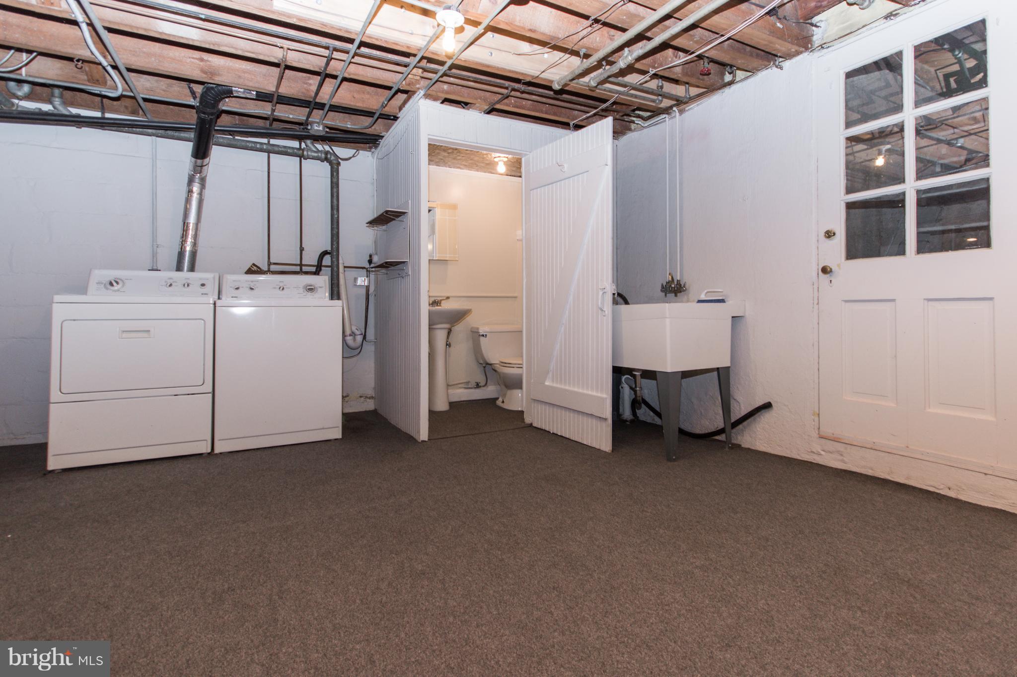 5001 Broadmoor Road Baltimore, MD 21212 - Photo 22 of 26 a utility room with dryer and washer