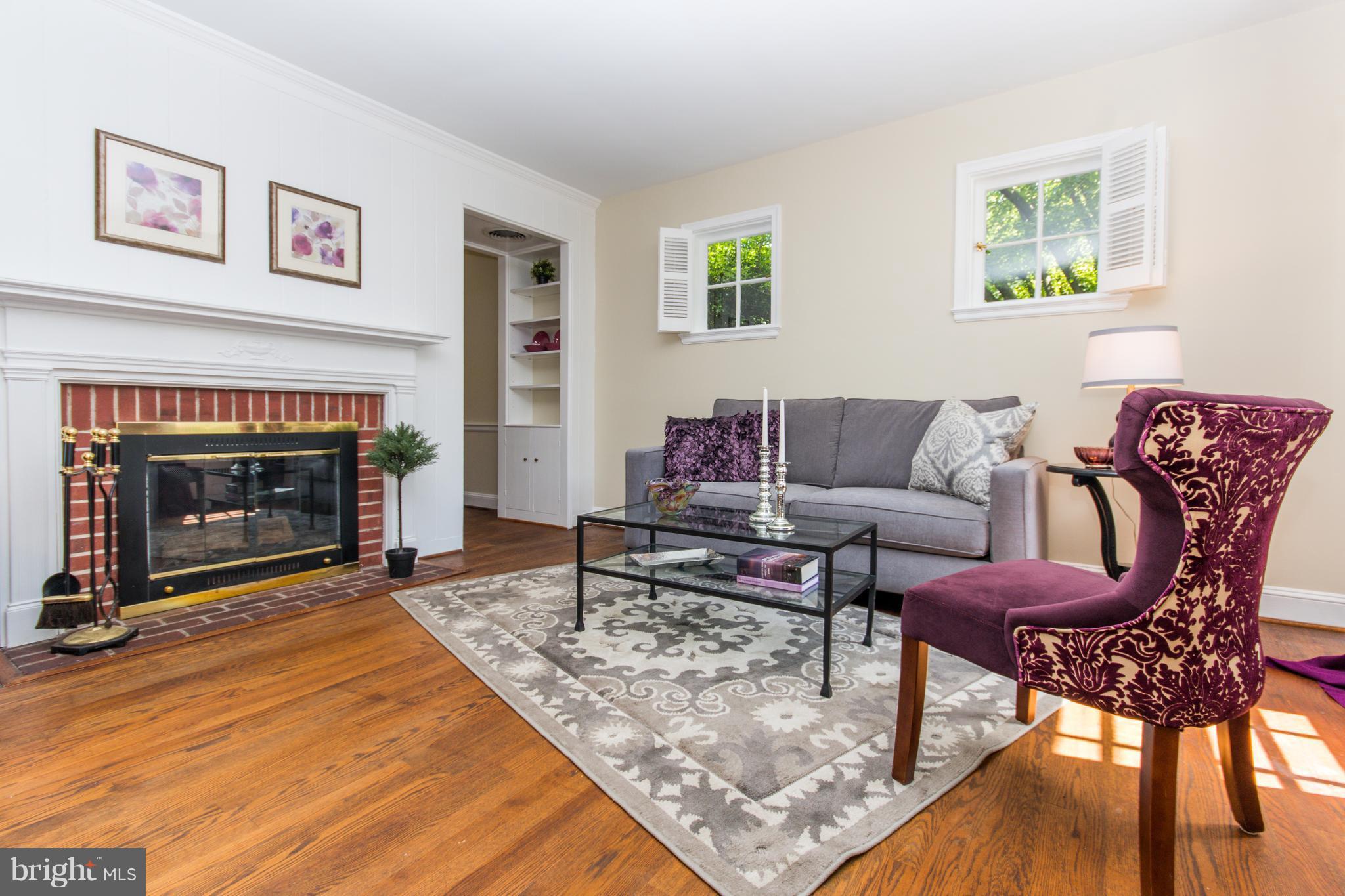 5001 Broadmoor Road Baltimore, MD 21212 - Photo 4 of 26 a living room with furniture and a fireplace