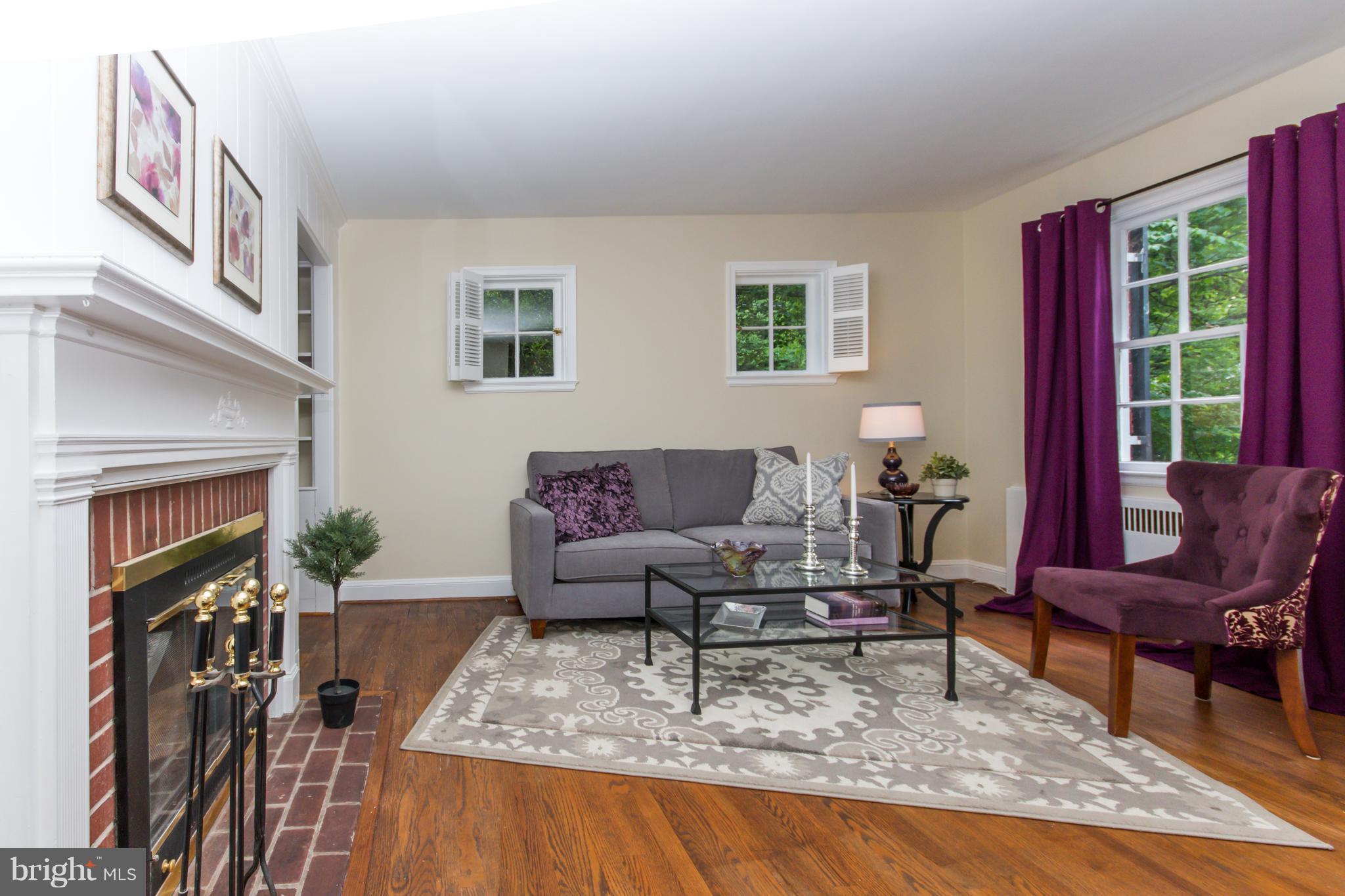 5001 Broadmoor Road Baltimore, MD 21212 - Photo 5 of 26 a living room with furniture fireplace and a window