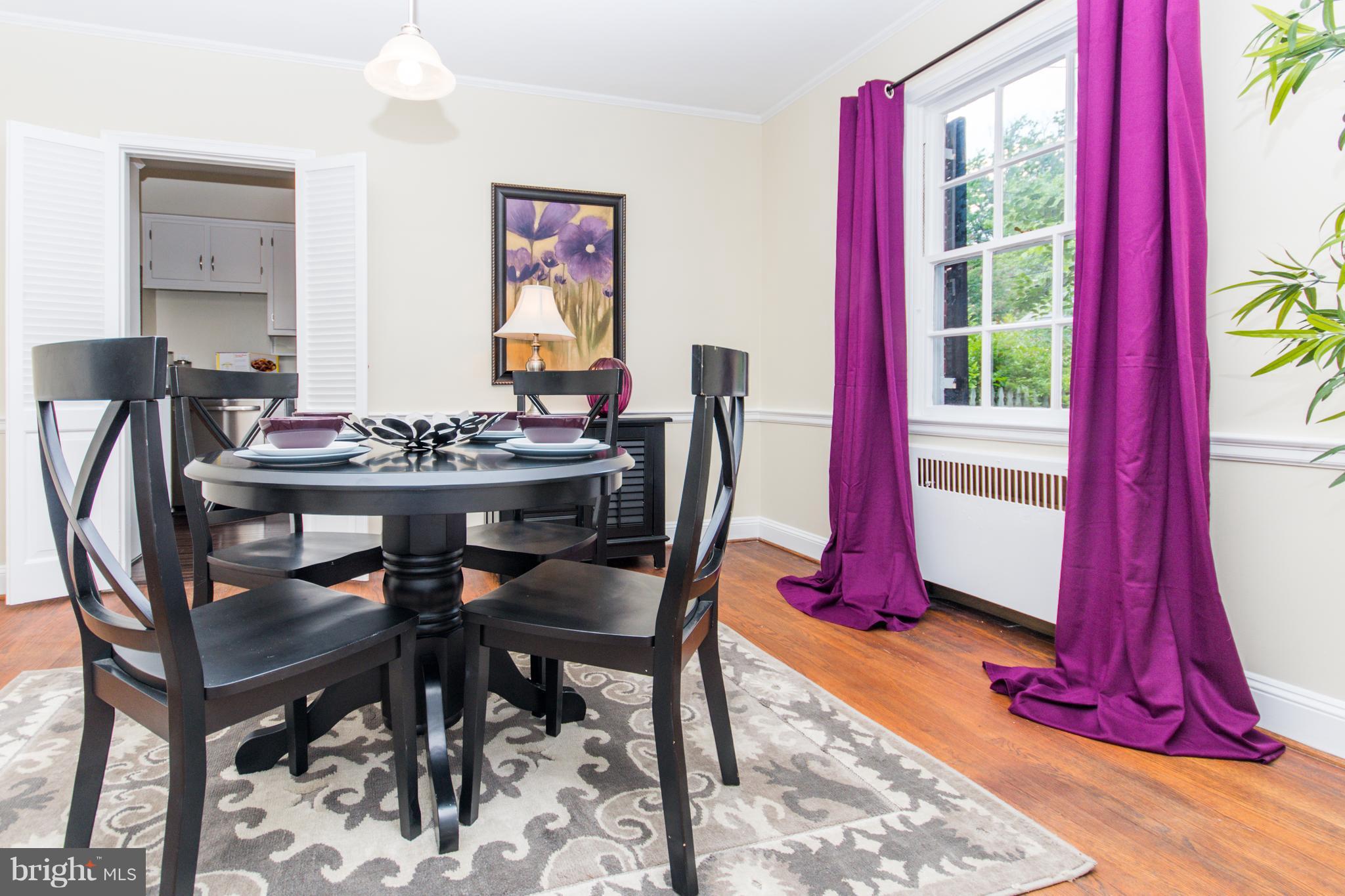 5001 Broadmoor Road Baltimore, MD 21212 - Photo 6 of 26 a view of a dining room with furniture window and outside view