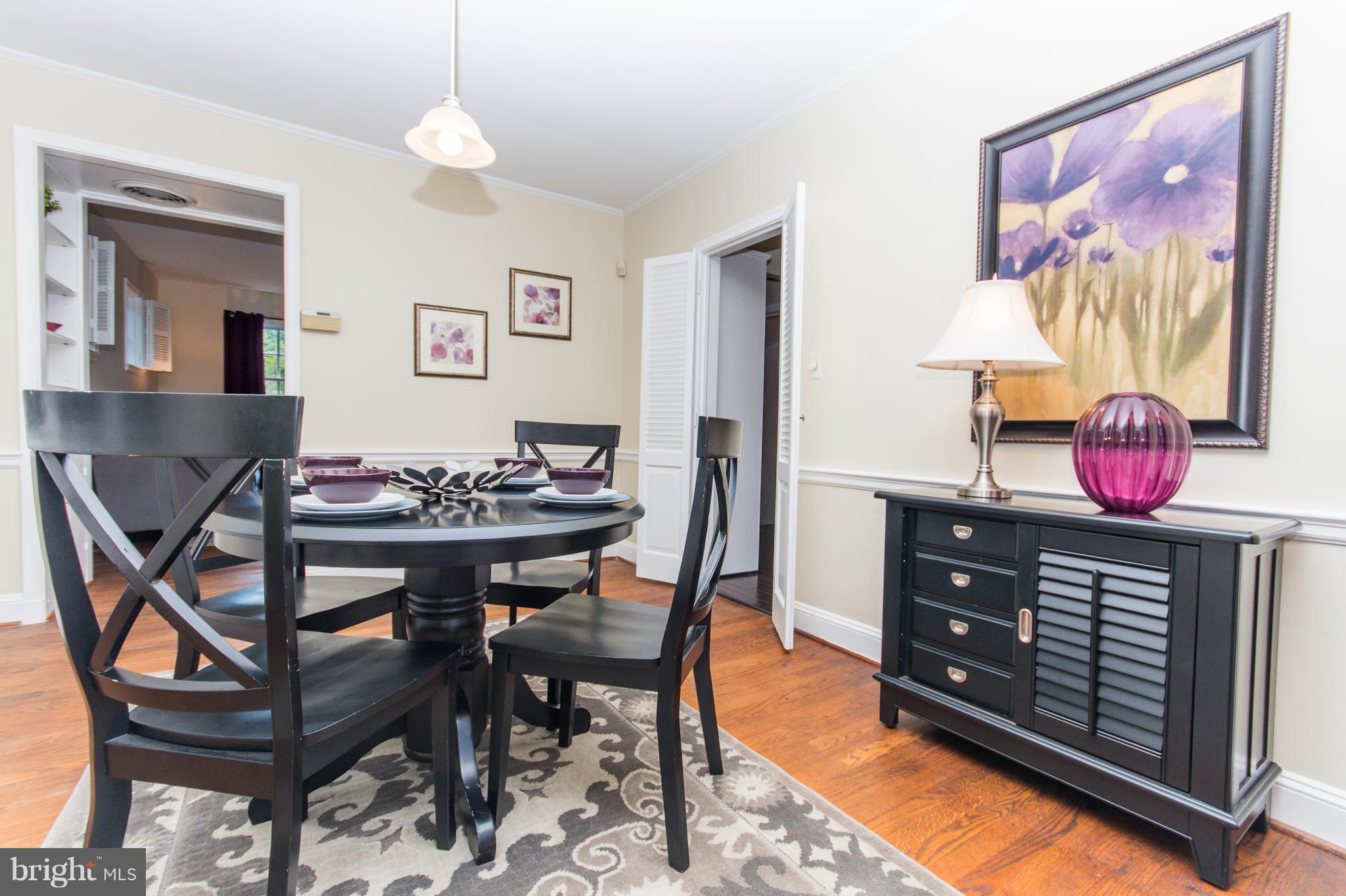 5001 Broadmoor Road Baltimore, MD 21212 - Photo 7 of 26 a room with a table and chairs
