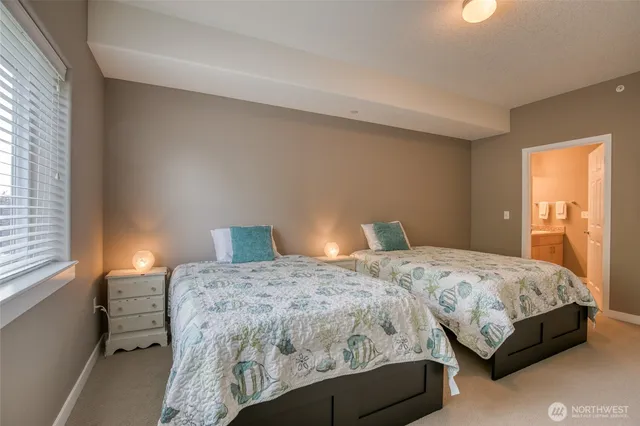 a bedroom with a bed and a lamp