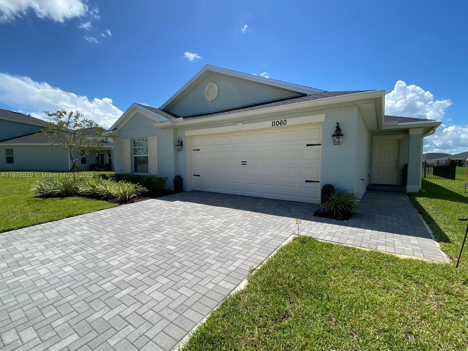 11060 Middle Strm Drive Port St. Lucie, FL 34987 - Photo 1 of 41 a view of a house with a yard