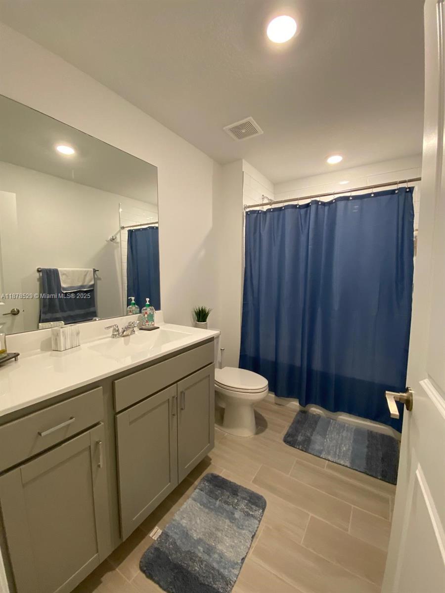 11060 Middle Strm Drive Port St. Lucie, FL 34987 - Photo 21 of 41 a bathroom with a sink and a mirror