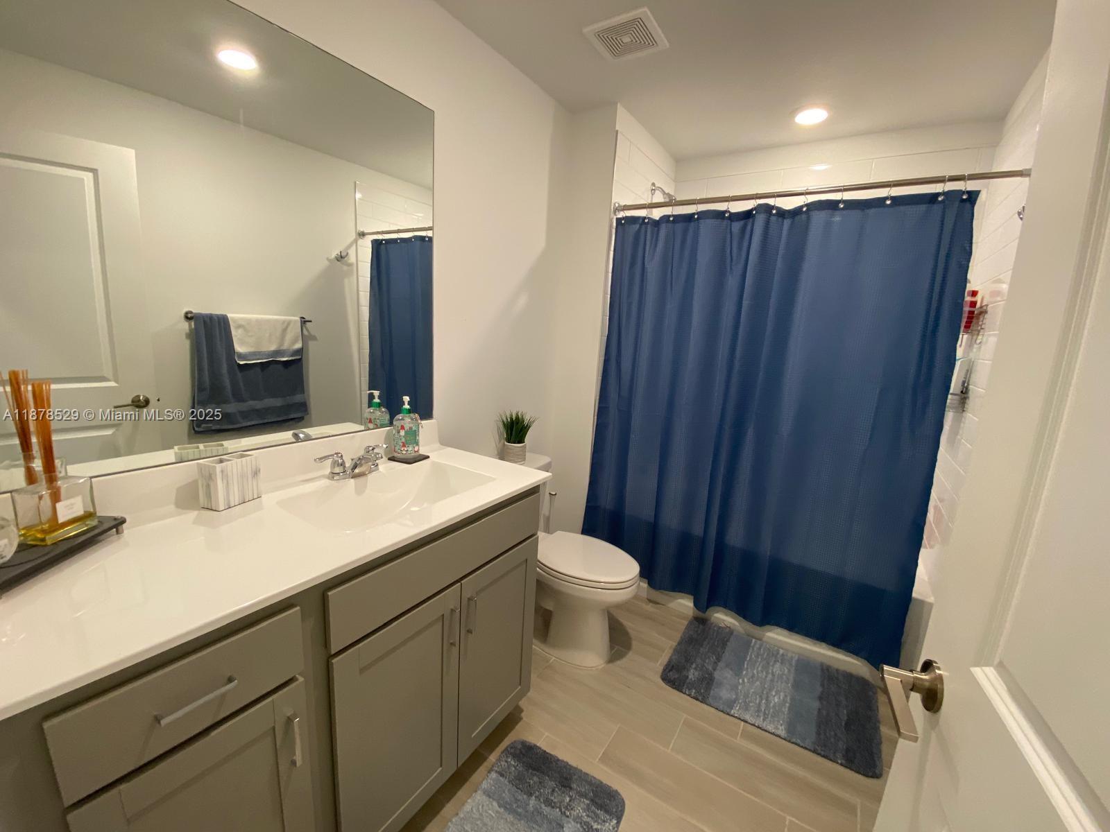11060 Middle Strm Drive Port St. Lucie, FL 34987 - Photo 25 of 41 a bathroom with a sink and a mirror