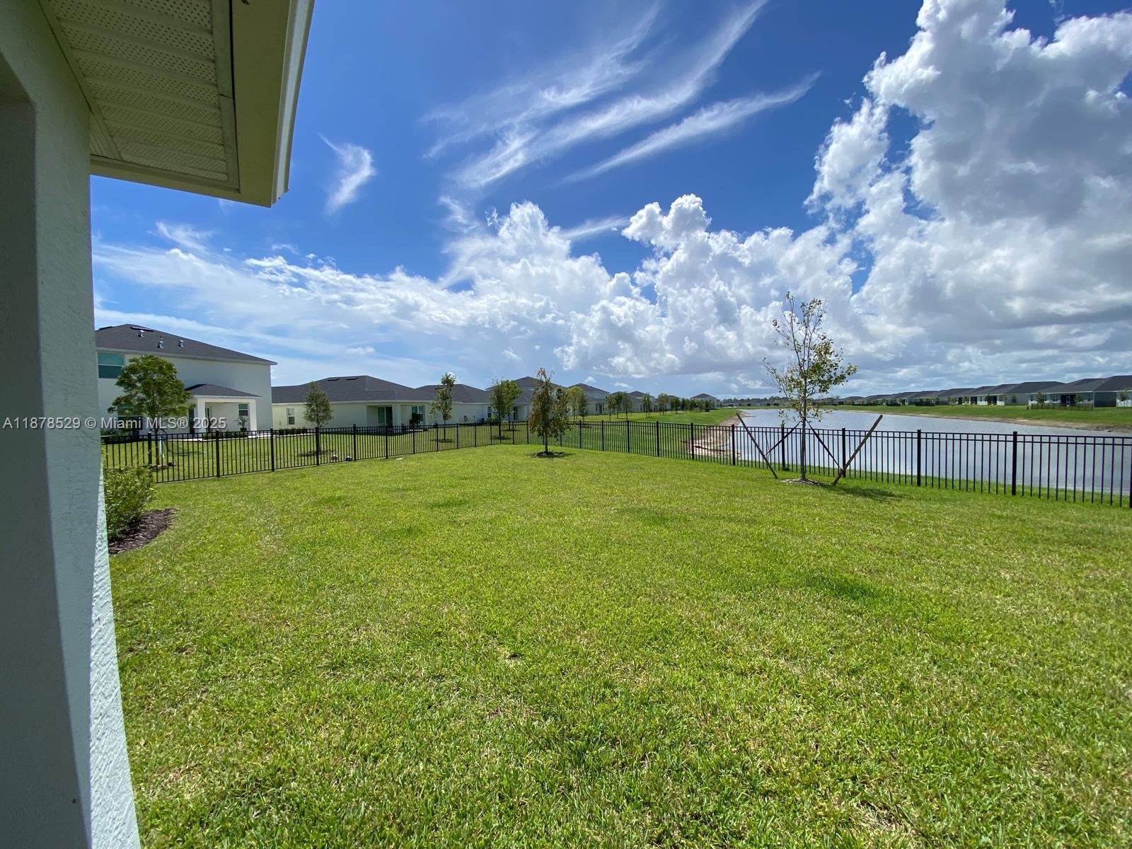 11060 Middle Strm Drive Port St. Lucie, FL 34987 - Photo 3 of 41 a view of a green field