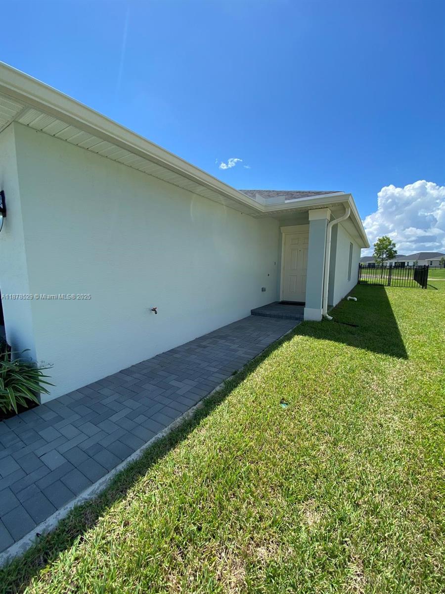 11060 Middle Strm Drive Port St. Lucie, FL 34987 - Photo 36 of 41 a view of a backyard