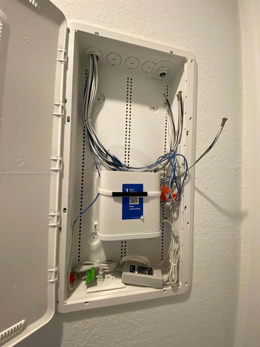 11060 Middle Strm Drive Port St. Lucie, FL 34987 - Photo 40 of 41 a bathroom with a mirror and a sink